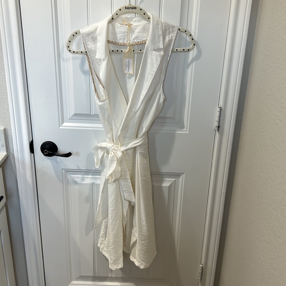 Brand new sleeveless cardigan